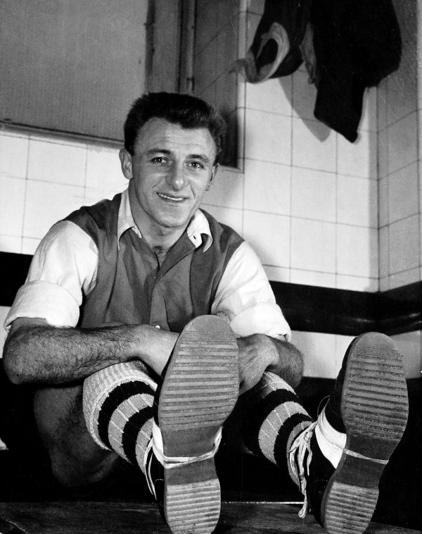 Tommy Docherty with revolutionary boots